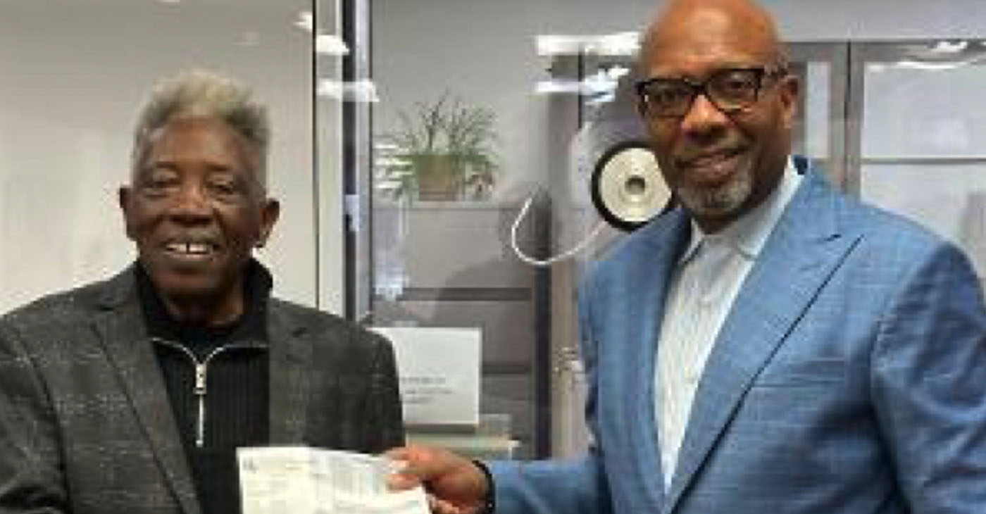 Dr. Sylvester Rutledge and Pastor Michael Wallace with receipts at the Alameda County Tax Assessor’s Office on March 7, 2023.