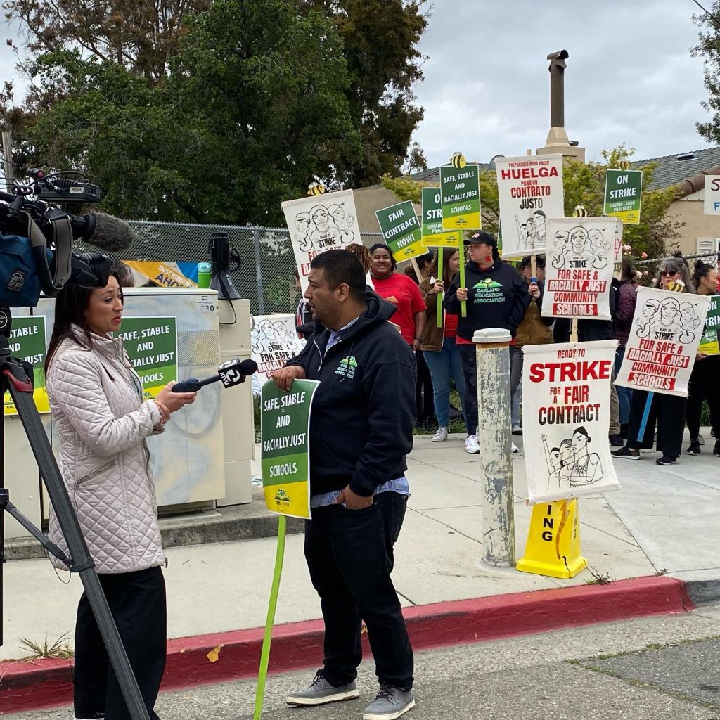 Teachers' union President Ismael “Ish” Armendariz speaks to press at school picket line. Photo courtesy of OEA.