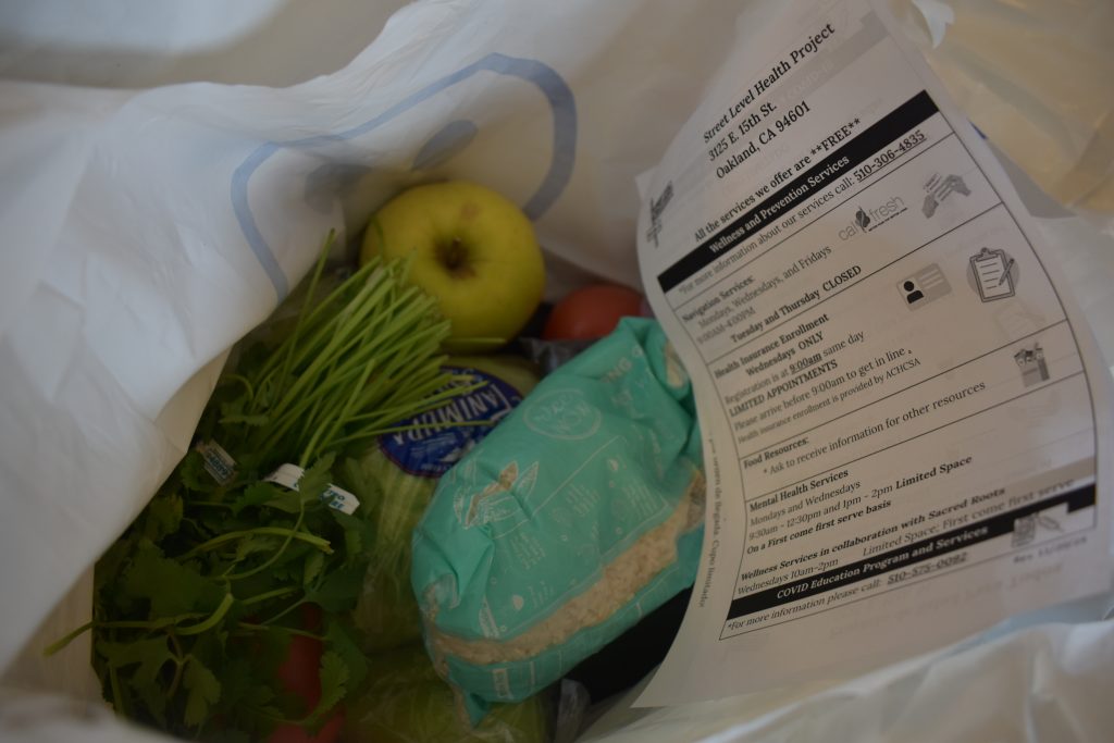 Street Level Health Project is providing weekly grocery bags to immigrant day laborers and their families to address the growing need for food in the community. Photo by Magaly Muñoz.